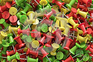 several assorted colors of plastic push pins