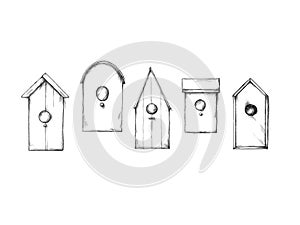 Several birdhouses, nesting boxes on a neutral background