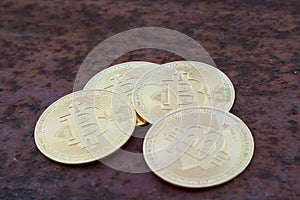 Several bitcoin Coins on rusty iron close up - image