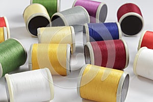 Several bobbins of cotton thread for sewing machines