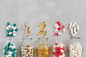 Several bottles of supplements pills. Variety of nutritional supplements and vitamin capsules.