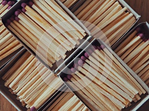 Several boxes filled with matches, a close-up shot. Matchboxes