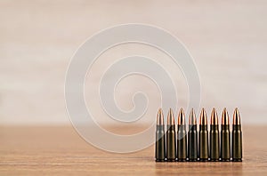 Several bullets on a wooden background