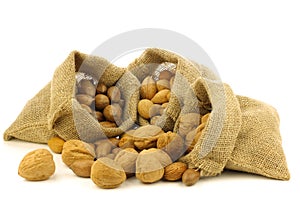 Several burlap bags with mixed nuts