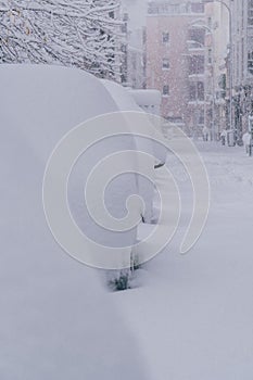 Several cars in the street in Madrid covered in snow due to historic snow storm Filomena photo