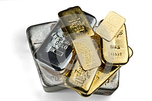 Several cast and minted gold bars and silver cast bars isolated on white background.