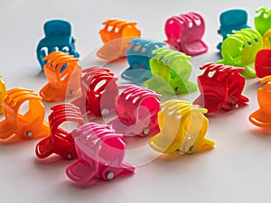 Several children`s, bright hair clips on a white background
