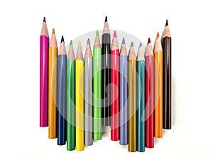 Several colored pencils are lined up