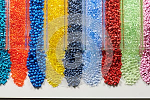 several colored plastic resins in test tubes in laboratory photo