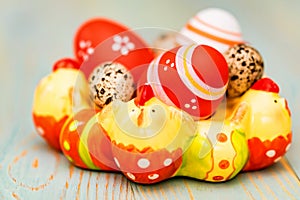 Several colorful Easter eggs in decorative tray