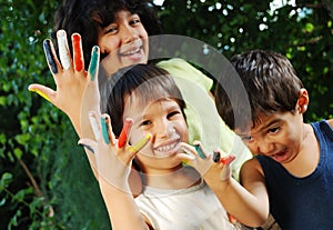 Several colors on children fingers outdoor