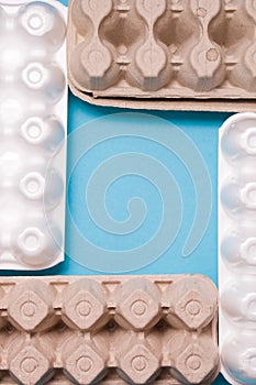 several different boxes for eggs are laid out in a square