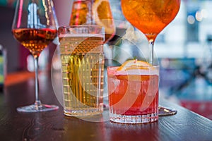 Several different smoothies in glasses of different shapes on the bar