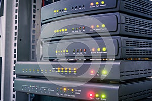 Several digital communication gateways are in the server room. Telephone voice routers are in the data center. Equipment for