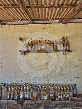 Several empty cachaÃÂ§a bottles