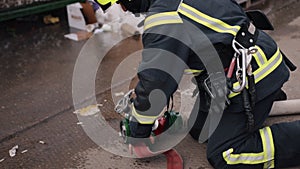 Several firefighters are preparing for day's event, firefighter wearing protective gear with helmet