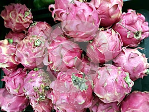 Several Fresh Dragon Fruits in a Basket