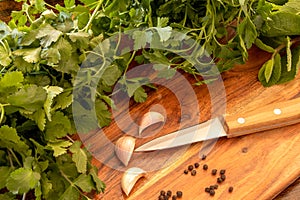 Several fresh herbs on a wooden background