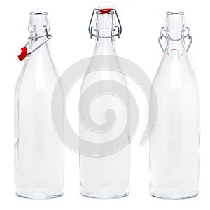 Several glass bottles with 1 liter soda type closures. Without label and isolated on white background