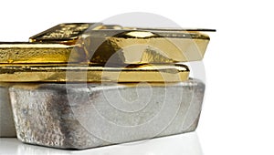 Several gold and silver bars of different weight isolated on a white