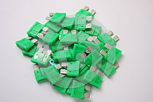 Several green car fuses