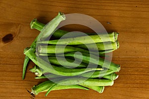 Several green okra on the table photo