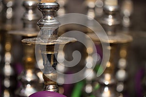 Several Hookahs Lined Up In A Cafe Bar