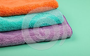 Several household microfiber clothes and mops