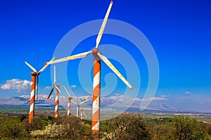 Several huge modern windmills