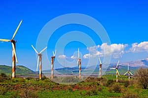 Several huge modern windmills