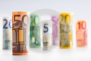 Several hundred euro banknotes stacked by value. Euro money concept. Rolls Euro banknotes. Euro currency.