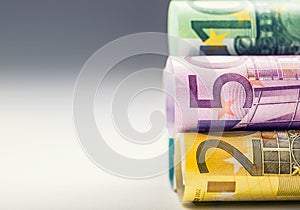 Several hundred euro banknotes stacked by value. Euro money concept. Rolls Euro banknotes. Euro currency.