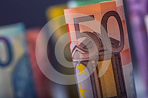 Several hundred euro banknotes stacked by value. Euro money concept. Rolls Euro banknotes. Euro currency.