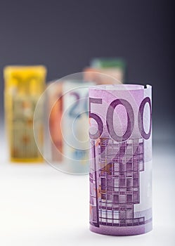 Several hundred euro banknotes stacked by value. Euro money concept. Rolls Euro banknotes. Euro currency.