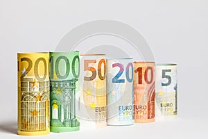 Several hundred euro banknotes stacked by value.Rolls Euro bankn