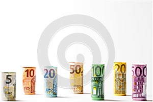 Several hundred euro banknotes stacked by value.Rolls Euro bankn