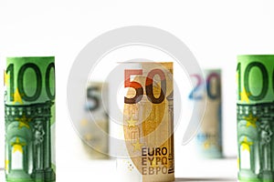 Several hundred euro banknotes stacked by value.Rolls Euro bankn