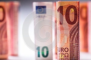 Several hundred euro banknotes stacked by value.Rolls Euro banknotes.Euro currency money.
