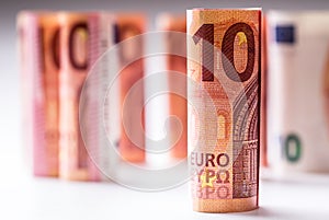 Several hundred euro banknotes stacked by value.Rolls Euro banknotes.Euro currency money.