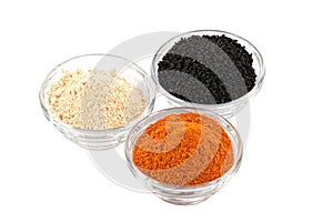 Several indian spices in glass bowls bowl