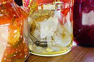 Several jars of tinned vegetables on a wooden table