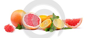 Several kinds of multi-colorful, whole and cut citrus fruits isolated on white background. Organic lemons, grapefruits and oranges