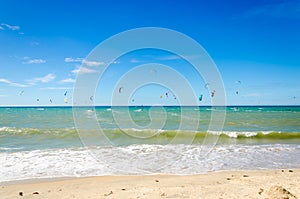 Several kite surfing on the air at the Cumbuco