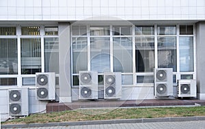 Several large air conditioning units, group of air conditioning compressors out of office building