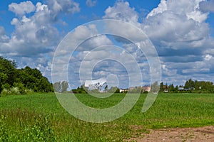 Several large satellite communication antennas in a field against a blue sky. Space Communication Center