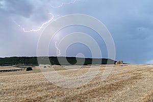 Several lightning strikes on a mountain