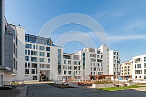 Several low-rise houses with children playground mixed-use urban multi-family residential district area development