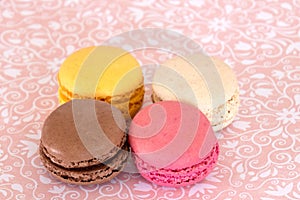 Several macaroons on a pink background