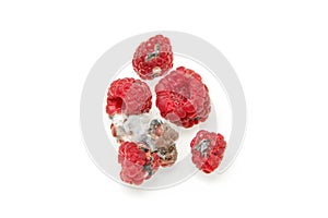 Several mouldy raspberries