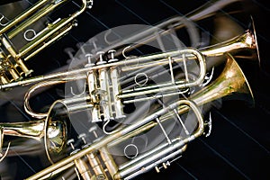 Several musical wind instruments orchestra golden trumpets. photo
